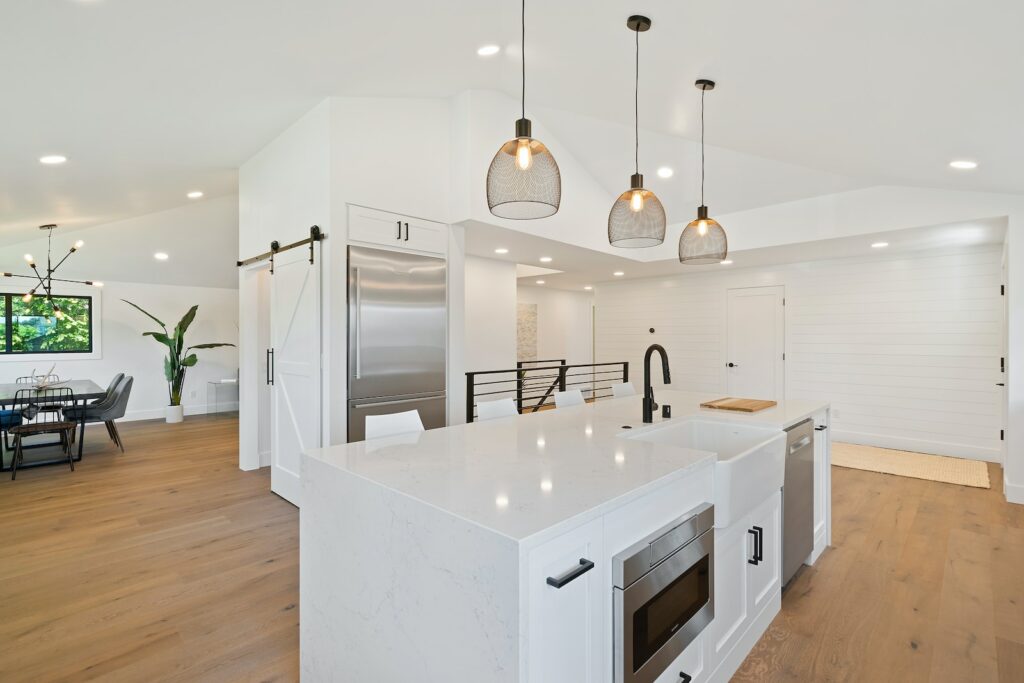 turned on pendant lamps above kitchen island